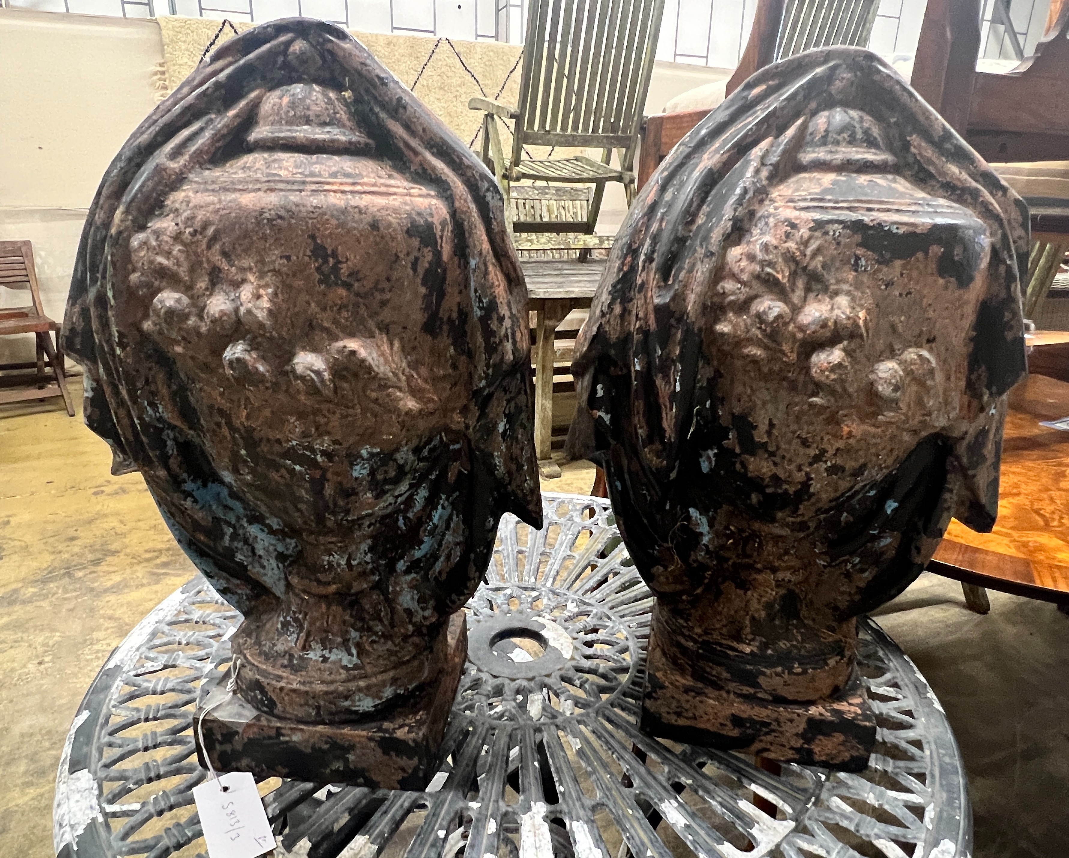 A pair of painted cast iron floral swag urn finials, height 46cm